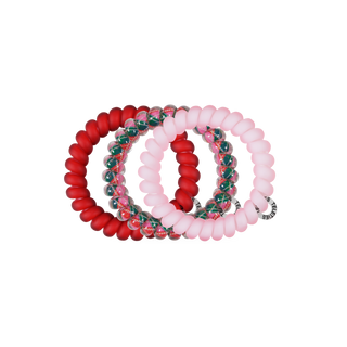 TELETIES large hair ties in pink and red tartan, stacked as coiled rings