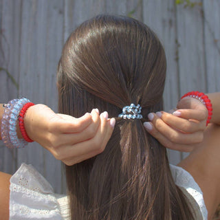 TELETIES hair secured with red and clear light-blue gingham coiled hair ties