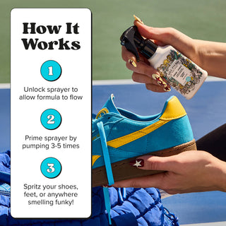 Shoe odor spray bottle with black trigger held in hand, applying to a sneaker.