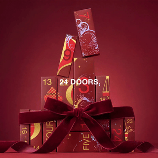 Farmasi beauty advent calendar boxes tied with a burgundy ribbon bow