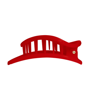Red flat circle hair clip with curved bar prongs