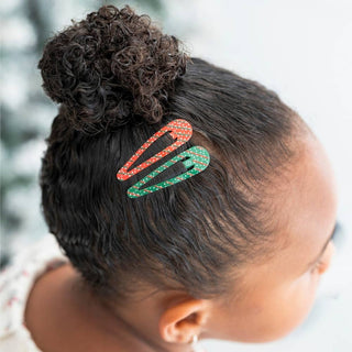 TELETIES two holiday confetti hair clips on child's curly hair, red and green striped