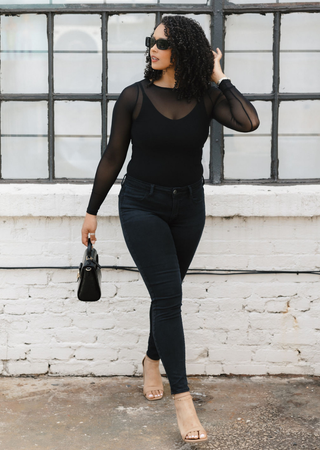Elietian Seamless Sheer Mesh Top in Black with black jeans, walking view