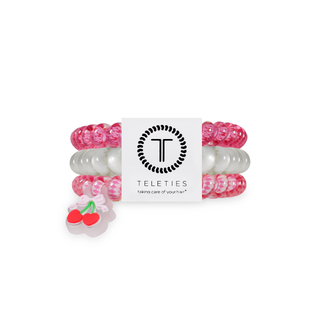 Assorted spiral hair coil ties with cherry charm and pink-white tones