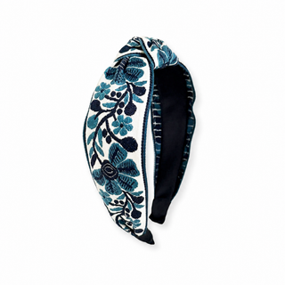 Navy floral woven headband with embroidered flowers and leaves, black interior