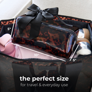 Case-Mate tortoiseshell jelly makeup bag with black bow holding travel essentials