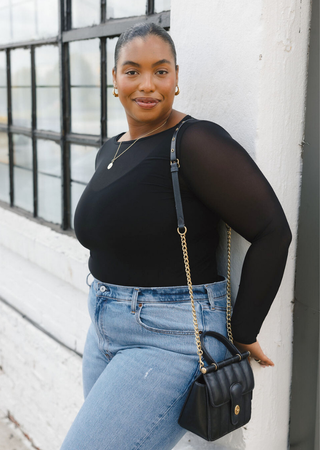 Elietian Seamless Sheer Mesh Top in Black with jeans and a quilted crossbody bag