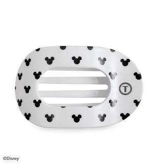 White flat round hair clip with black Mickey icons and silver bar.