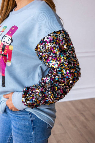 Nutcrackers on Blue with Sequin Sleeves