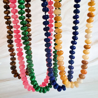 Multi-strand beaded necklace set with brown, pink, green, and blue round beads