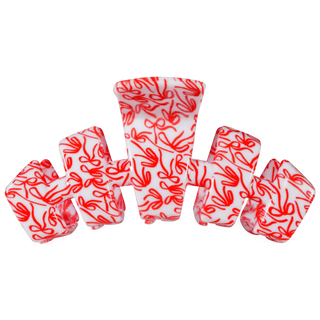 Large hair clip in red with white all-over swirl pattern