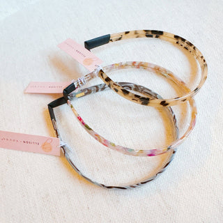 Stacked tortoise-pattern slim headbands with multicolor marble resin bands
