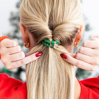 TELETIES beaded hair tie on blonde hair bun with green and red-striped spiral bands
