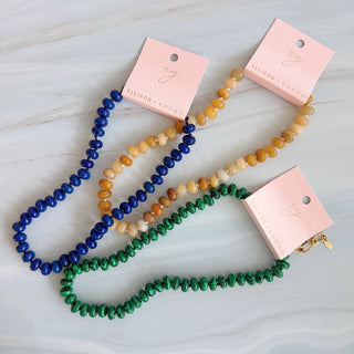 Tiger-eye brown bead necklace with round stone beads, layered with blue and green strands
