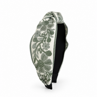 Sage floral woven headband with embroidered leaf pattern and black inner band