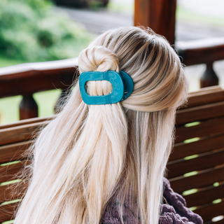 Teleties medium flat round hair clip in Teal With It blue-green, shown in hair