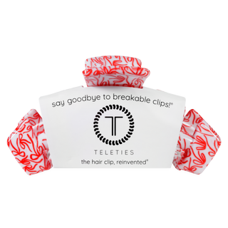 Large hair clip set on retail card, red-and-white swirl pattern