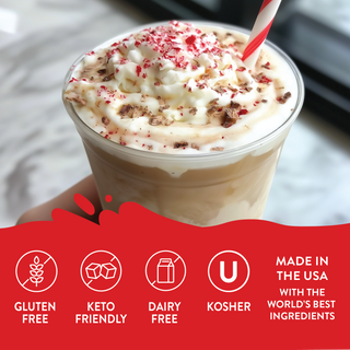 Jordan's Skinny Mixes cup of creamy white chocolate peppermint syrup drink with whipped cream and red bits