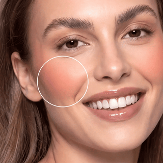 Cheek makeup close-up with soft blush sheen highlighted by a circle