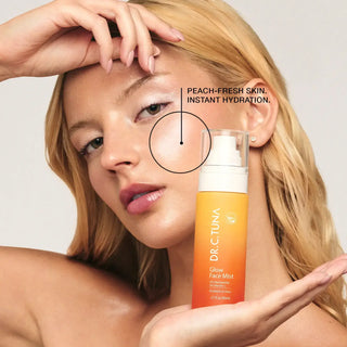 Dr. C. Tuna glow face mist bottle with white cap and peach-orange liquid