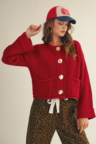 LovLov red gold button ribbed knit pocket cardigan worn buttoned with leopard wide leg pants – front view