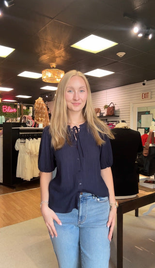 LINEN BLENDED RUFFLE TRIM FRONT TIE BLOUSE
