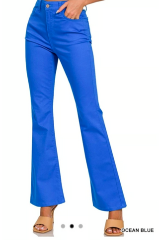 Ocean blue high-rise boot cut flare leg jeans, front view, worn with tan heeled sandals