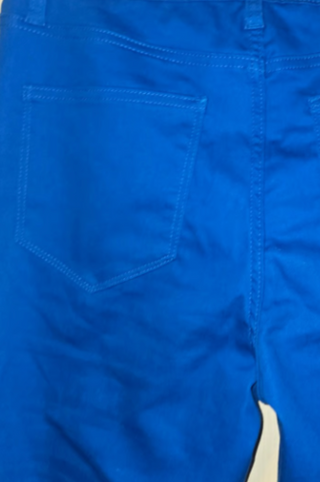 Close-up of the back pocket and stitching on ocean blue flare jeans
