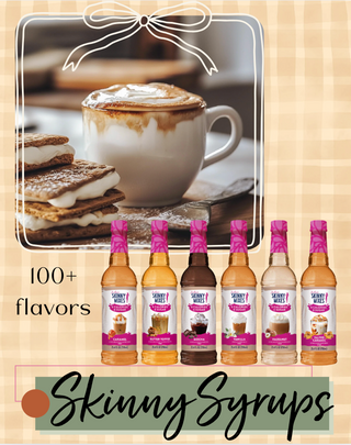 Promotional image of Skinny Syrups with a cup of coffee and s'mores on a wooden background.