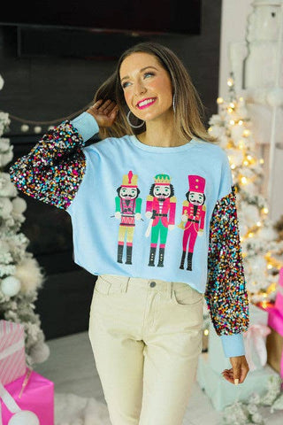 Nutcrackers on Blue with Sequin Sleeves