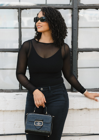 Elietian Seamless Sheer Mesh Top in Black over a black tank with sunglasses and a handbag