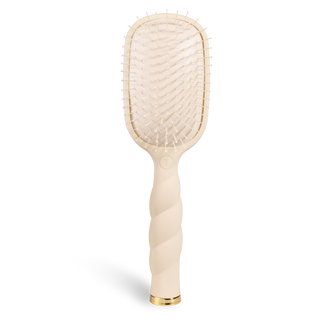 Detangling hair brush with cream cushion and white pins on cream handle
