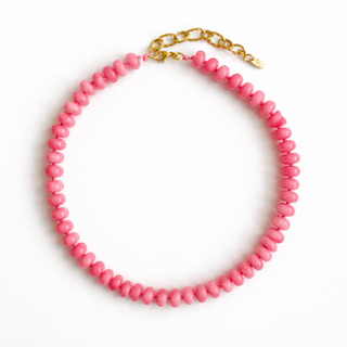 Single-strand pink beaded necklace with gold-toned chain and lobster clasp