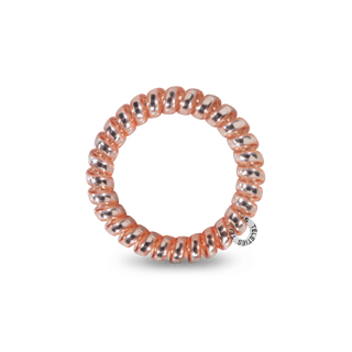 TELETIES large rose-pink coiled hair tie, circular close-up