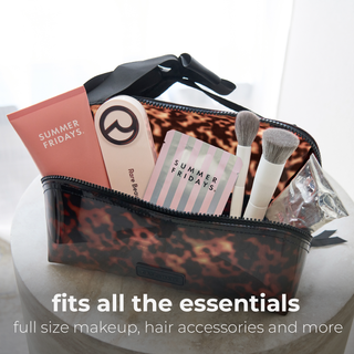 Case-Mate tortoiseshell lay-flat makeup bag with black bow, opened flat for easy access