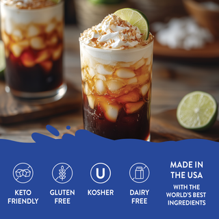 Jordan's Skinny Mixes glass of sweet cream dirty soda with creamy topping and lime garnish