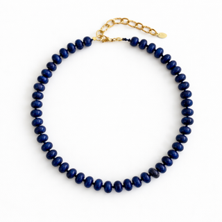 Single-strand navy beaded necklace with gold-toned chain and lobster clasp