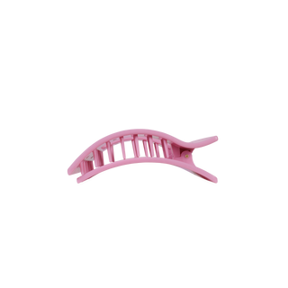 Pink flat rectangle hair clip side view with bow graphic and arched prongs