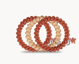 Teleties spiral hair coil hair ties in red glitter and beige shells