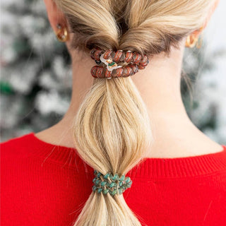 TELETIES plaid and holiday-print hair ties holding blonde hair in a ponytail