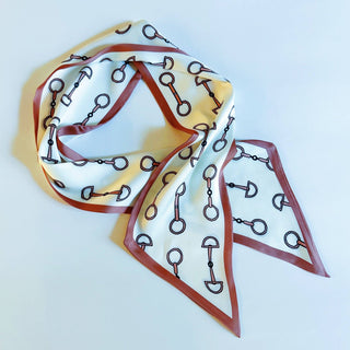 Chain link border scarf laid flat: white fabric with blue and brown chain print, long tails