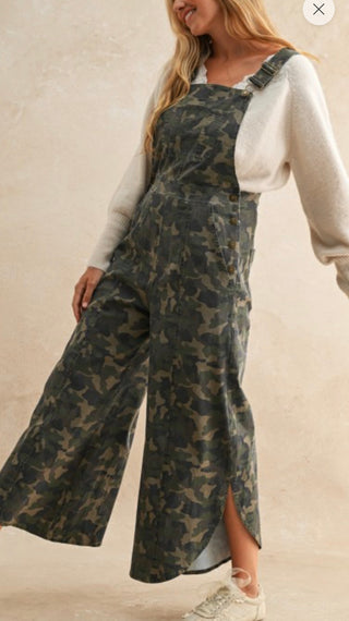 Olive camo wide leg overalls with split tulip hem, side view