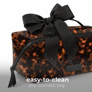 Case-Mate tortoiseshell jelly cosmetic bag with black bow and zip closure, wipe-clean finish