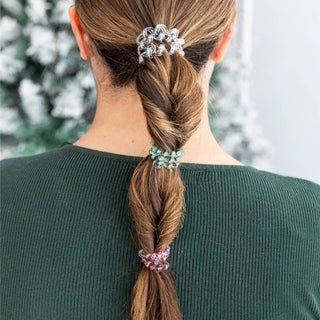 TELETIES small hair ties securing brown hair in a ponytail with silver clips