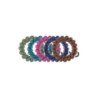 Teleties Sweater Swatches tiny spiral hair ties in a row in green, pink, teal, navy and brown