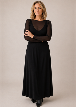 Elietian Seamless Sheer Mesh Top in Black layered over a black maxi dress, full-length view