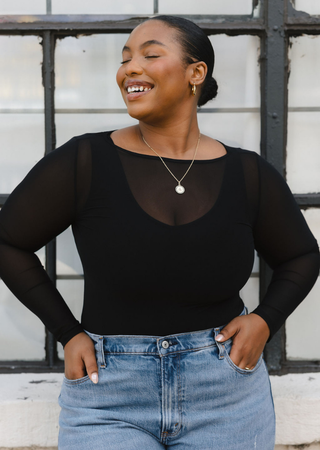 Elietian Seamless Sheer Mesh Top in Black with light jeans, curvy model, front view