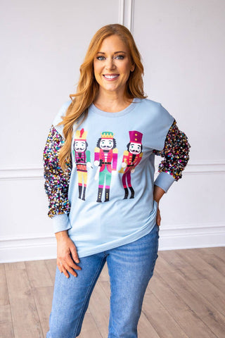 Nutcrackers on Blue with Sequin Sleeves