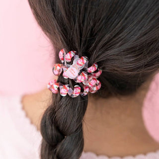 TELETIES coiled hair ties on dark hair ponytail in red, pink, and green colors
