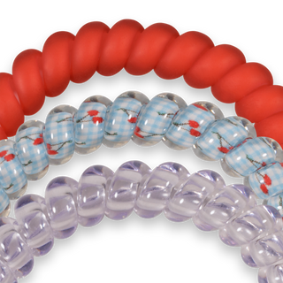 TELETIES close-up of red and clear light-blue gingham spiral hair ties